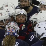 Team USA gathers at mid ice after defeating Sweden 6-1 during a 2014 Winter Olympics women's semifinal ice hockey game at Shayba Arena, Monday, Feb. 17, 2014, in Sochi, Russia. (AP Photo/Matt Slocum)