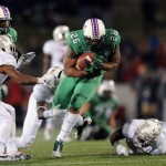 Marshall's Harold Hoskins (26) breaks away from Maryland's defense for a first down in the second half of the Military Bowl NCAA college football game on Friday, Dec. 27, 2013, in Annapolis, Md. Marshall won 31-20. (AP Photo/Gail Burton)