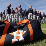 Houston Astros players gather before a spring training baseball workout Saturday, Feb. 16, 2013, in Kissimmee, Fla. (AP Photo/David J. Phillip)
