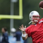 New England Patriots quarterback Tim Tebow throws during a team football practice in Foxborough, Mass., Tuesday June 11, 2013. (AP Photo/Charles Krupa)