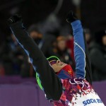 China's Wu Chao celebrates after jumping jumps during men's freestyle skiing aerials qualifying at the Rosa Khutor Extreme Park at the 2014 Winter Olympics, Monday, Feb. 17, 2014, in Krasnaya Polyana, Russia.(AP Photo/Andy Wong)
