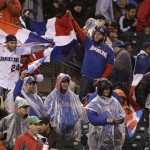 Fans of the Dominican Republic cheer after pitcher Samuel Deduno struck out Puerto Rico's Angel Pagan during the fifth inning of the championship game of the World Baseball Classic in San Francisco, Tuesday, March 19, 2013. (AP Photo/Eric Risberg)