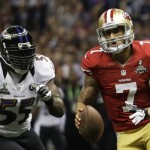 San Francisco 49ers quarterback Colin Kaepernick (7) carries the ball past Baltimore Ravens linebacker Terrell Suggs (55) during the first half of the NFL Super Bowl XLVII football game, Sunday, Feb. 3, 2013, in New Orleans. (AP Photo/Matt Slocum)
