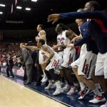 Arizona's bench celebrates the win during the closing seconds of an NCAA college basketball game against Florida at McKale Center in Tucson, Ariz., Saturday, Dec. 15, 2012. Arizona won 65 - 64. (AP Photo/Wily Low)