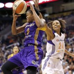 Los Angeles Sparks' Alana Beard (0) pulls down a rebound over Phoenix Mercury's DeWanna Bonner (24) during the first half of Game 2 of a WNBA basketball Western Conference semifinal series, Saturday, Sept. 21, 2013, in Phoenix. (AP Photo/Matt York