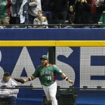 Mexico's Karim Garcia makes a catch in front of the fence on a ball hit by United States' Giancarlo Stanton in the eighth inning of a World Baseball Classic baseball game on Friday, March 8, 2013, in Phoenix. Mexico defeated the United States 5-2. (AP Photo/Ross D. Franklin)
