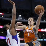 Phoenix Suns' Goran Dragic, right, of Slovania, goes to the basket as Los Angeles Clippers' Ronny Turiaf, of France, defends during the second half of an NBA basketball game in Los Angeles, Saturday, Dec. 8, 2012. The Clippers won 117-99. (AP Photo/Jae C. Hong)

