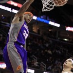 Phoenix Suns' Shannon Brown (26) dunks in front of Cleveland Cavaliers' Anderson Varejao during the first quarter in an NBA basketball game Tuesday, Nov. 27, 2012, in Cleveland. (AP Photo/Tony Dejak)