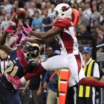 St. Louis Rams cornerback Janoris Jenkins, left, breaks up a pass intended for Arizona Cardinals wide receiver Andre Roberts during the second quarter of an NFL football game, Thursday, Oct. 4, 2012, in St. Louis. (AP Photo/Tom Gannam)