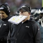 Philadelphia Eagles head coach Chip Kelly stands on the sideline as a play is being reviewed during the first half of an NFL wild-card playoff football game against the New Orleans Saints, Saturday, Jan. 4, 2014, in Philadelphia. (AP Photo/Michael Perez)