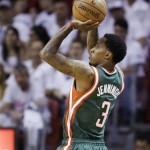 Milwaukee Bucks' Brandon Jennings (3) shoots against the Miami Heat during the first half of Game 1 of their first-round NBA basketball playoff series in Miami, Sunday April 21, 2013. The Heat won 110-87. (AP Photo/Alan Diaz)