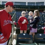 Los Angeles Angels' Josh Hamilton talks to fans before an exhibition spring training baseball game against the San Francisco Giants Wednesday, Feb. 27, 2013, in Tempe, Ariz. (AP Photo/Morry Gash)