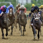 Oxbow, right, with jockey Gary Stevens aboard, leads the field to the finish line to win the 138th Preakness Stakes horse race at Pimlico Race Course, Saturday, May 18, 2013, in Baltimore. (AP Photo/Patrick Semansky)
