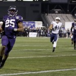 Washington running back Bishop Sankey (25) scores on a rushing touchdown against BYU during first half of the Fight Hunger Bowl NCAA college football game Friday, Dec. 27, 2013, in San Francisco. (AP Photo/Marcio Jose Sanchez)