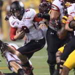 Utah quarterback Jon Hays, left, is hauled down from behind by Arizona State defensive end Davon Coleman, right, in the first quarter of an NCAA college football game, Saturday, Sept. 22, 2012, in Tempe, Ariz.(AP Photo/Paul Connors)
