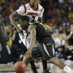 Wichita State's Malcolm Armstead (2) moves the ball against Louisville's Russ Smith (2) during the second half of the NCAA Final Four tournament college basketball semifinal game Saturday, April 6, 2013, in Atlanta. (AP Photo/David J. Phillip)
