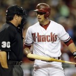 Arizona Diamondbacks' Martin Prado talks with home plate umpire Rob Drake (30) after being called out on a foul tip during the first inning of a baseball game against the Los Angeles Dodgers, Tuesday, Sept. 17, 2013, in Phoenix. (AP Photo/Matt York)