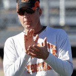 Oklahoma State head coach Mike Gundy claps his hands during his teams football practice Tuesday, Dec. 27, 2011, in Scottsdale, Ariz. Oklahoma State will face Stanford in the Fiesta Bowl on Jan. 2, 2012. (AP Photo/Matt York)