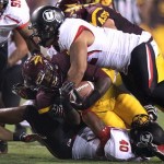 Arizona State running back Marion Grice, center, is tackled by Utah linebackers L.T. Filiaga, top, and Jacoby Hale, bottom, in the first quarter of a college football game, Saturday, Sept. 22, 2012, in Tempe, Ariz. (AP Photo/Paul Connors)
