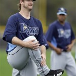 Tampa Bay Rays pitcher Jeff Neimann smiles as he stretches his legs during a spring training workout Thursday, Feb. 14, 2013, in Port Charlotte, Fla. (AP Photo/Chris O'Meara)