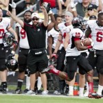 Northern Illinois wide receiver Tommylee Lewis returns the opening kickoff of the second half for a touchdown against Purdue during an NCAA college football game in West Lafayette, Ind. on Saturday, Sept. 28, 2013. (AP Photo/The Journal & Courier, Brent Drinkut)