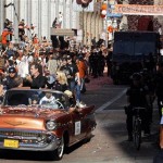 San Francisco Giants manager Bruce Bochy holds up the World Series trophy while riding in a car during a baseball World Series parade in downtown San Francisco, Wednesday, Nov. 3, 2010. The Giants defeated the Texas Rangers in five games for their first championship since the team moved west from New York 52 years ago. (AP Photo/Paul Sakuma)