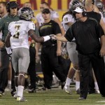 Oregon cornerback Dior Mathis (3) is congratulated by head coach Chip Kelly after Mathis intercepted a pass against Arizona State during the second half of an NCAA college football game, Thursday, Oct. 18, 2012, in Tempe, Ariz. Oregon won 43-21. (AP Photo/Matt York)