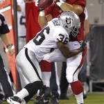 Arizona Cardinals running back Anthony Sherman pulls in a pass as Oakland Raiders defensive back Shawntae Spencer (36) makes the tackle during the first half of a preseason NFL football game, Friday, Aug. 17, 2012, in Glendale, Ariz. (AP Photo/Matt York)