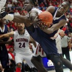 Duquesne's Mamadou Datt, front, and Arizona's Angelo Chol, behind, battle for the ball during the first half of an NCAA college basketball game at McKale Center in Tucson, Ariz., Wednesday, Nov. 9, 2011. (AP Photo/Wily Low)