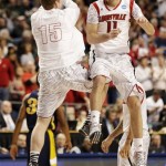 Louisville's Luke Hancock (11) and Tim Henderson (15) celebrate during the second half of a second-round game in the NCAA college basketball tournament against the North Carolina A&T Thursday, March 21, 2013, in Lexington, Ky. (AP Photo/John Bazemore)