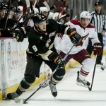 Anaheim Ducks left wing Bobby Ryan looks to pass away from Phoenix Coyotes left wing Ray Whitney, right, during the first period of an NHL hockey game, Sunday, Oct. 23, 2011, in Anaheim, Calif. The Coyotes won 5-4. (AP Photo/Bret Hartman)