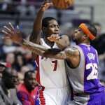 Detroit Pistons guard Brandon Knight (7) passes the ball against Phoenix Suns guard Shannon Brown (26) in the first half of an NBA basketball game, Wednesday, Nov. 28, 2012, in Auburn Hills, Mich. (AP Photo/Duane Burleson)