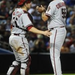 Arizona Diamondbacks pitcher Josh Collmenter is approached at the mound by catcher Miguel Montero before being removed from the baseball game against the Atlanta Braves, Tuesday, June 26, 2012, in Atlanta. (AP Photo/John Amis)