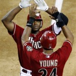 Arizona Diamondbacks' Justin Upton greets Chris 
Young (24) at home plate after Upton hit a 
three-run home run against the Seattle Mariners 
during the fifth inning of an interleague 
baseball game, Wednesday, June 20, 2012, in 
Phoenix. (AP Photo/Matt York)
