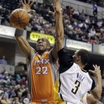 Phoenix Suns' Michael Redd loses control of the ball as he goes up for a shot against Indiana Pacers' George Hill during the first half of an NBA basketball game, Friday, March 23, 2012, in Indianapolis. (AP Photo/Darron Cummings)