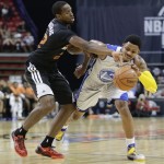 Phoenix Suns' Dionte Christmas, left, strips the ball from Golden State Warriors guard Kent Bazemore in the first quarter of the NBA Summer League championship game, Monday, July 22, 2013, in Las Vegas. (AP Photo/Julie Jacobson)