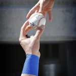 A fan reaches for an autographed ball before the Arizona Diamondbacks against the Chicago Cubs spring training baseball game on Thursday, Feb. 27, 2014, Mesa, Ariz. (AP Photo/Matt York)