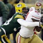  Green Bay Packers cornerback Micah Hyde (33) tackles after San Francisco 49ers wide receiver Anquan Boldin (81) makes a reception during the first half of an NFL wild-card playoff football game, Sunday, Jan. 5, 2014, in Green Bay, Wis. (AP Photo/Mike Roemer)