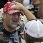 Tony Kanaan, of Brazil, is congratulated by car owner Jimmy Vasser after winning the Indianapolis 500 auto race at the Indianapolis Motor Speedway in Indianapolis, Sunday, May 26, 2013. (AP Photo/Darron Cummings)