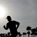 Tampa Bay Rays' Jeff Niemann is silhouetted as he runs during a spring training baseball workout Saturday, Feb. 16, 2013, in Port Charlotte, Fla. (AP Photo/Chris O'Meara)
