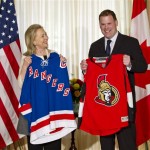 Displaying loyalty to their respective hockey teams, Secretary of State Hillary Rodham Clinton holds a New York Rangers NHL Hockey jersey as Canadian Foreign Minister John Baird holds an Ottawa Senators jersey following a meeting of the G8 foreign ministers at Blair House in Washington, Thursday, April 12, 2012. The Rangers and Senators open their Stanley Cup playoff series tonight in New York. (AP Photo/J. Scott Applewhite)