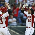 Canada's Michael Saunders (20) celebrates his home run against the United States with teammate Justin Morneau in the second inning of a World Baseball Classic baseball game on Sunday, March 10, 2013, in Phoenix. (AP Photo/Ross D. Franklin)