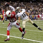 Arizona Cardinals defensive back Tyrann Mathieu (32) intercepts a pass intended for New Orleans Saints wide receiver Lance Moore (16) in the end zone in the second half of an NFL football game in New Orleans, Sunday, Sept. 22, 2013. (AP Photo/Bill Haber)