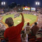 St. Louis Cardinals fan Dawn Schallenberg, of Bethalto, Ill., cheers as the Cardinals are introduced before Game 5 of a National League baseball division series against the Pittsburgh Pirates on Wednesday, Oct. 9, 2013, in St. Louis. (AP Photo/Mark Humphrey)