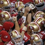 San Francisco 49ers players huddle before the NFL Super Bowl XLVII football game against the Baltimore Ravens, Sunday, Feb. 3, 2013, in New Orleans. (AP Photo/Charlie Riedel)