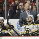 Boston Bruins coach Claude Julien watches play in the first period against the Chicago Blackhawks during Game 5 of the NHL hockey Stanley Cup Finals, Saturday, June 22, 2013, in Chicago. (AP Photo/Nam Y. Huh)
