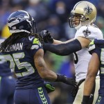 Seattle Seahawks cornerback Richard Sherman (25) and New Orleans Saints tight end Jimmy Graham (80) confront each other during the second half of an NFC divisional playoff NFL football game in Seattle, Saturday, Jan. 11, 2014. (AP Photo/Ted S. Warren)
