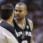 The San Antonio Spurs' Tony Parker (9) argues a call with NBA official Monty McCutchen (13) during the first half in Game 7 of the NBA basketball championships against the Miami Heat, Thursday, June 20, 2013, in Miami. (AP Photo/Lynne Sladky)