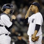 New York Yankees catcher Chris Stewart, left, talks with starting pitcher Ivan Nova after Nova allowed two runs to the Arizona Diamondbacks in the third inning of a baseball game at Yankee Stadium in New York, Tuesday, April 16, 2013. (AP Photo/Kathy Willens)