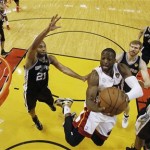 Miami Heat shooting guard Dwyane Wade (3) heads to the hoop against the San Antonio Spurs during the first half of Game 1 of basketball's NBA Finals, Thursday, June 6, 2013 in Miami. (AP Photo/Mike Segar, Pool)